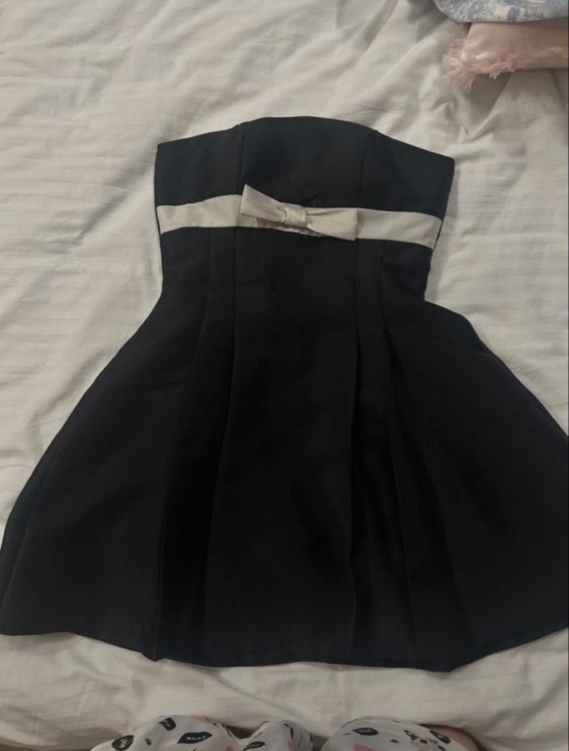 Black ribbon dress (Category: Dresses) located in Taguig. Submitted by chen.preloveddd (Listing ID 1451796175, Image 1). Description: - Can fit S-M frame - Waist 26-28 - Decluttering, no damages/stains 📍 Taguig south signal village Courier: Lalamove or jnt.