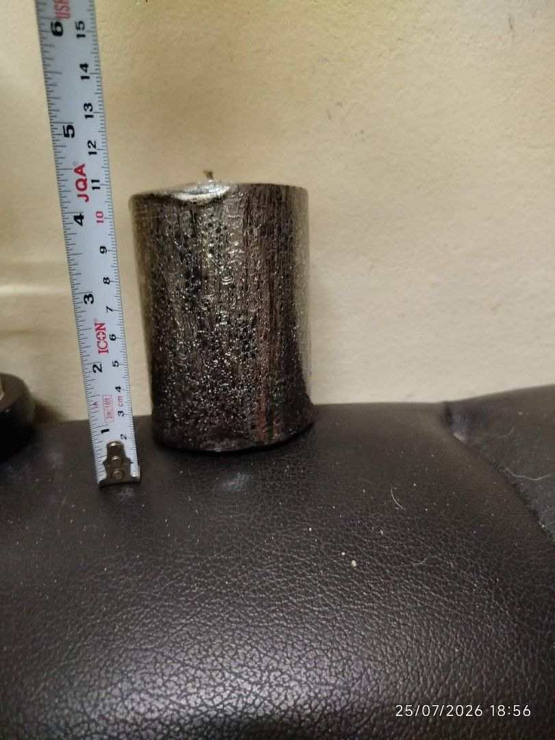 Black Textured Pillar Candle (Category: Home Fragrance) located in Quezon City. Submitted by chadrison (Listing ID 1451825974, Image 3). Description: - Black pillar candle - Textured finish - Metallic silver top detail - Approximately 4 inches tall - Lightly used, with plenty of burn time remaining - Ideal for home decor and creating a relaxing ambiance.