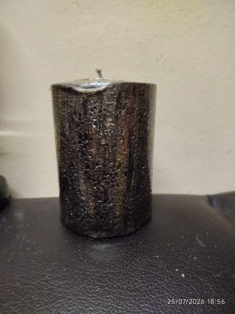 Black Textured Pillar Candle (Category: Home Fragrance) located in Quezon City. Submitted by chadrison (Listing ID 1451825974, Image 1). Description: - Black pillar candle - Textured finish - Metallic silver top detail - Approximately 4 inches tall - Lightly used, with plenty of burn time remaining - Ideal for home decor and creating a relaxing ambiance.