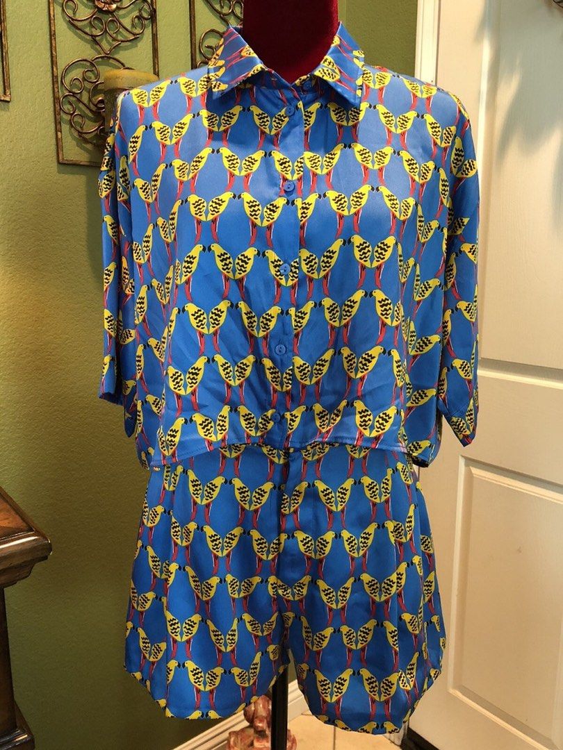 Blue Bird Print Button-Up Coord Set (Category: Sets or Coordinates) located in Quezon City. Submitted by closetcleanupfairy (Listing ID 1451802259, Image 2). Description: - Adorable matching set - Blue background with a fun bird print - Short-sleeve button-up shirt - Comfortable shorts - Versatile: great for casual outings or vacations - Can be worn as a set or as individual pieces.