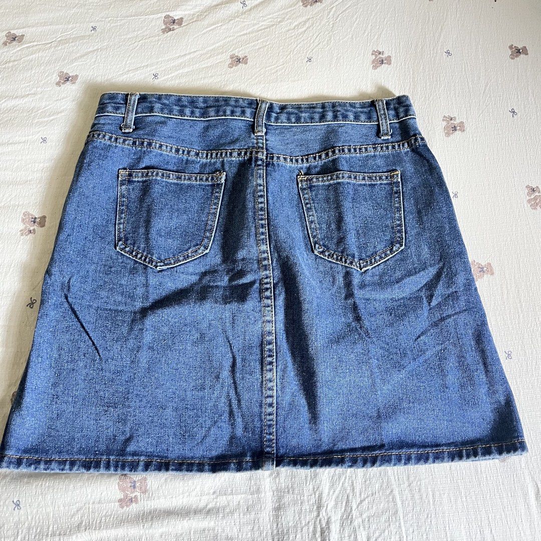 Blue Denim Button-Front A-Line Mini Skirt (Category: Skirts) located in Manila. Submitted by heraaa21 (Listing ID 1451748231, Image 2). Description: Classic blue denim A-line skirt with full button front and pockets. Size 30.
