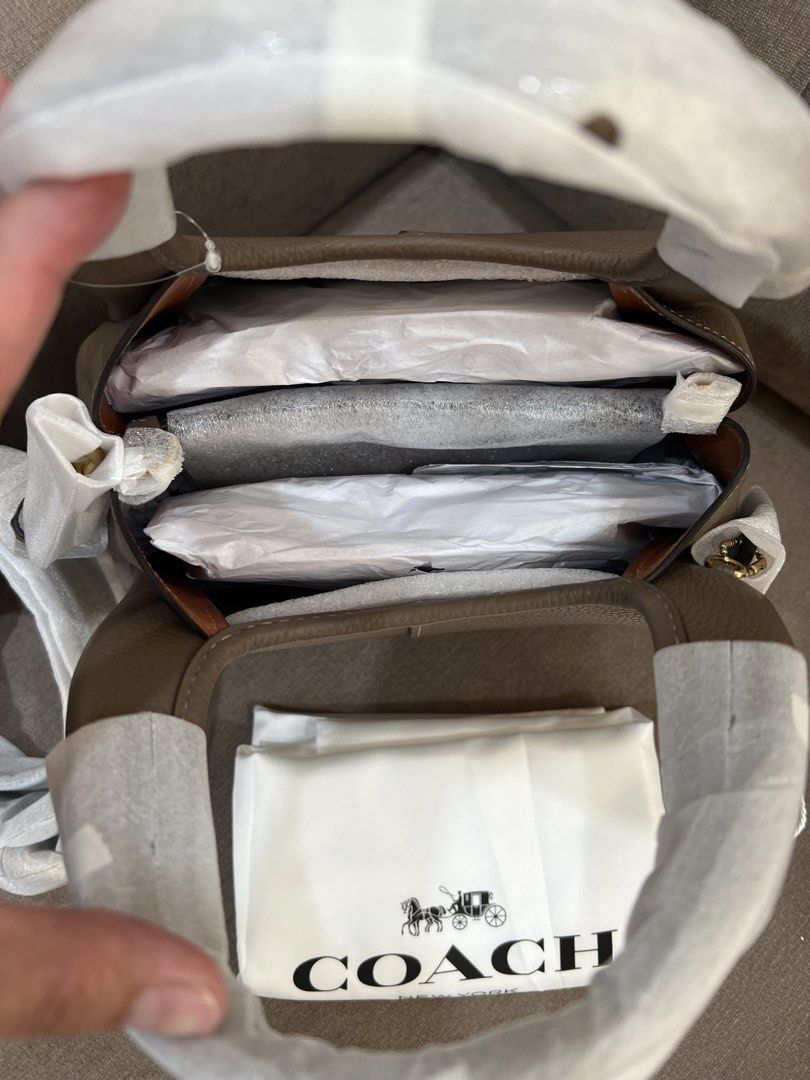 Bnew Coach Lana 23 Retail Sealed (Category: Shoulder Bags) located in Santa Rosa. Submitted by megally (Listing ID 1451719186, Image 2). Description: - Authentic Coach pebble leather shoulder bag - Color: Dark Stone - Comes with dust bag - Adjustable strap included - Interior is neat and organized - Ideal for everyday use 100% Original Send PM to inquire Lalamove,Grab,LBC ready Inclusion: Care card,Tag and Dust bag only.