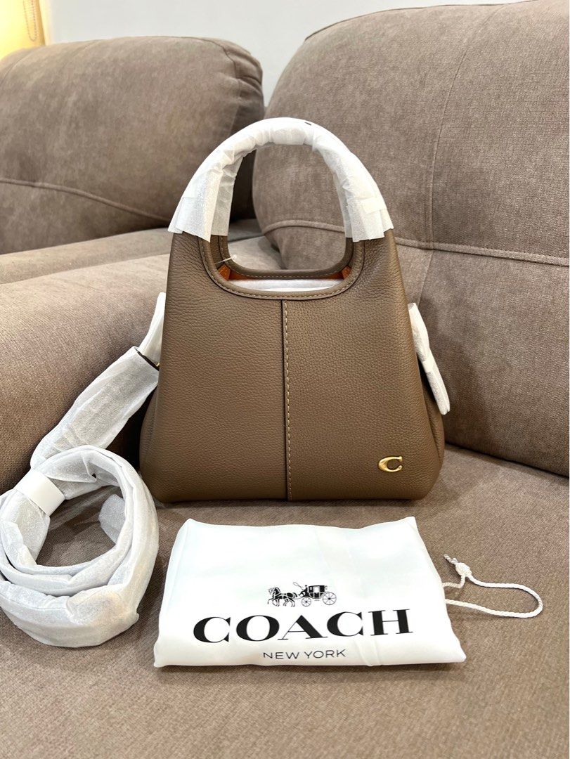 Bnew Coach Lana 23 Retail Sealed (Category: Shoulder Bags) located in Santa Rosa. Submitted by megally (Listing ID 1451719186, Image 1). Description: - Authentic Coach pebble leather shoulder bag - Color: Dark Stone - Comes with dust bag - Adjustable strap included - Interior is neat and organized - Ideal for everyday use 100% Original Send PM to inquire Lalamove,Grab,LBC ready Inclusion: Care card,Tag and Dust bag only.
