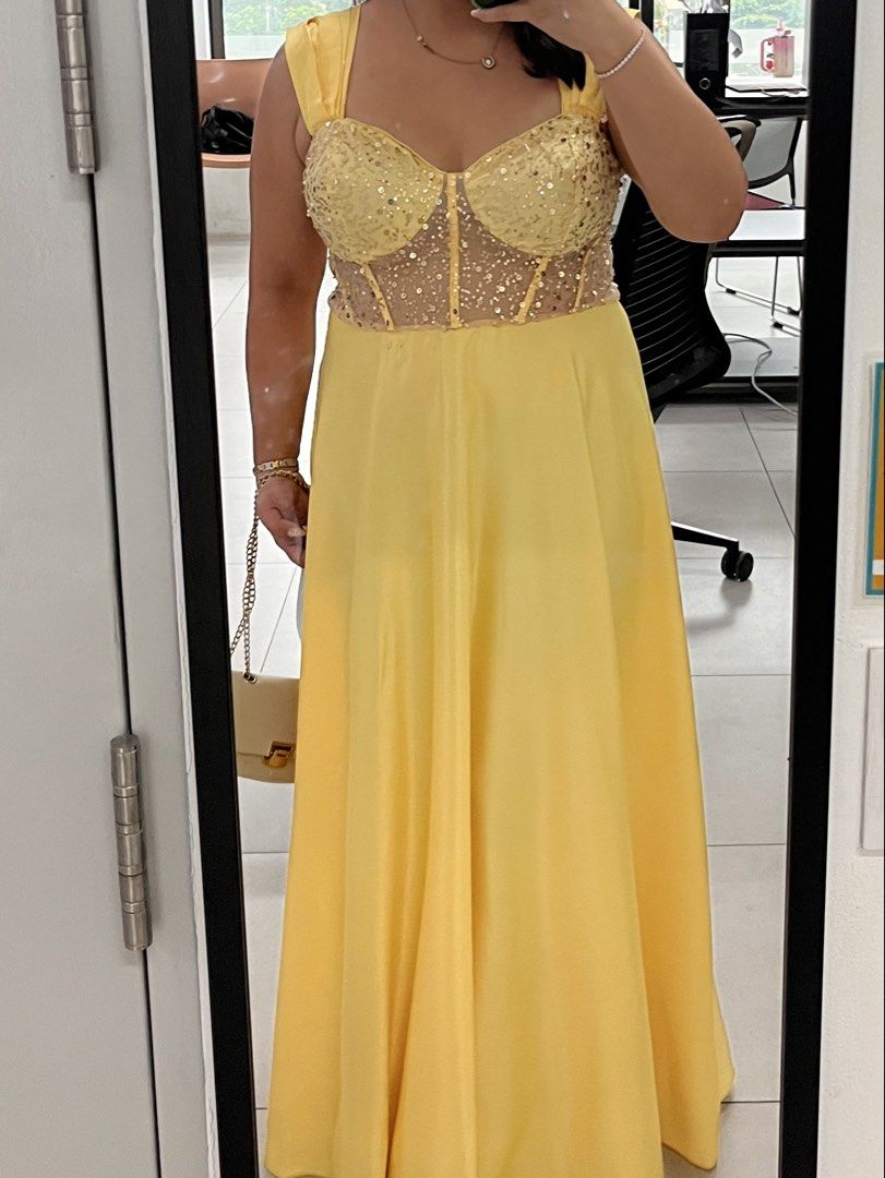 Bridesmaid Yellow Dress (Category: Dresses) located in Bacoor. Submitted by andi2001 (Listing ID 1451706939, Image 2). Description: - Eye-catching bright yellow satin dress - Bodice adorned with shimmering gold sequins - Flattering sweetheart neckline with wide straps - Flowy satin skirt for an elegant look - Ideal for parties and special events like Wedding .