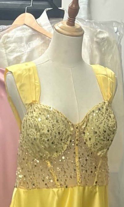 Bridesmaid Yellow Dress (Category: Dresses) located in Bacoor. Submitted by andi2001 (Listing ID 1451706939, Image 1). Description: - Eye-catching bright yellow satin dress - Bodice adorned with shimmering gold sequins - Flattering sweetheart neckline with wide straps - Flowy satin skirt for an elegant look - Ideal for parties and special events like Wedding .