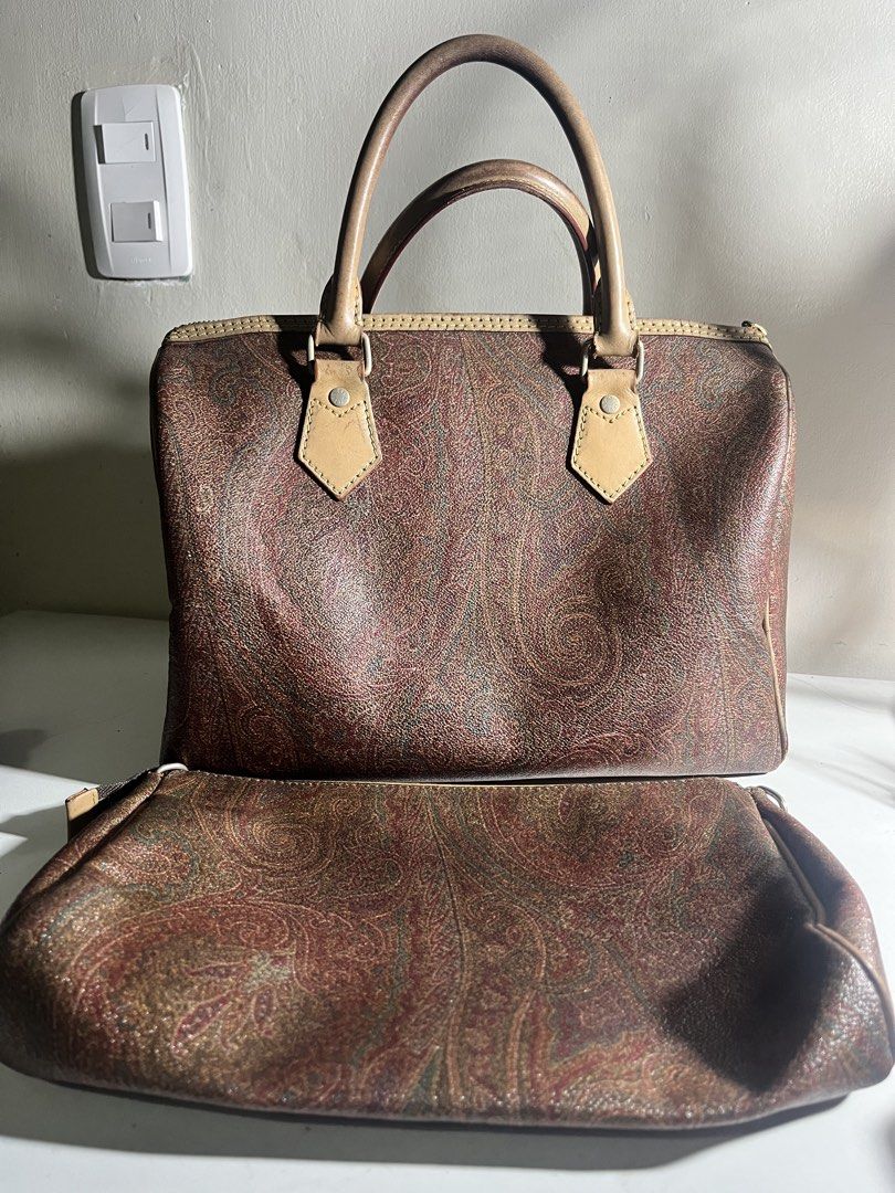 Bundle Etro Paisley Print Boston Bag with Matching Pouch (Category: Luxury Bags & Wallets) located in Manila. Submitted by mjdeclutters.mnl (Listing ID 1451839128, Image 3). Description: - Classic Etro paisley print - Set includes Boston-style bag and matching pouch - Genuine leather trim and handles - Zippers are in excellent working condition - Ideal for travel or everyday use - Iconic and timeless design.
