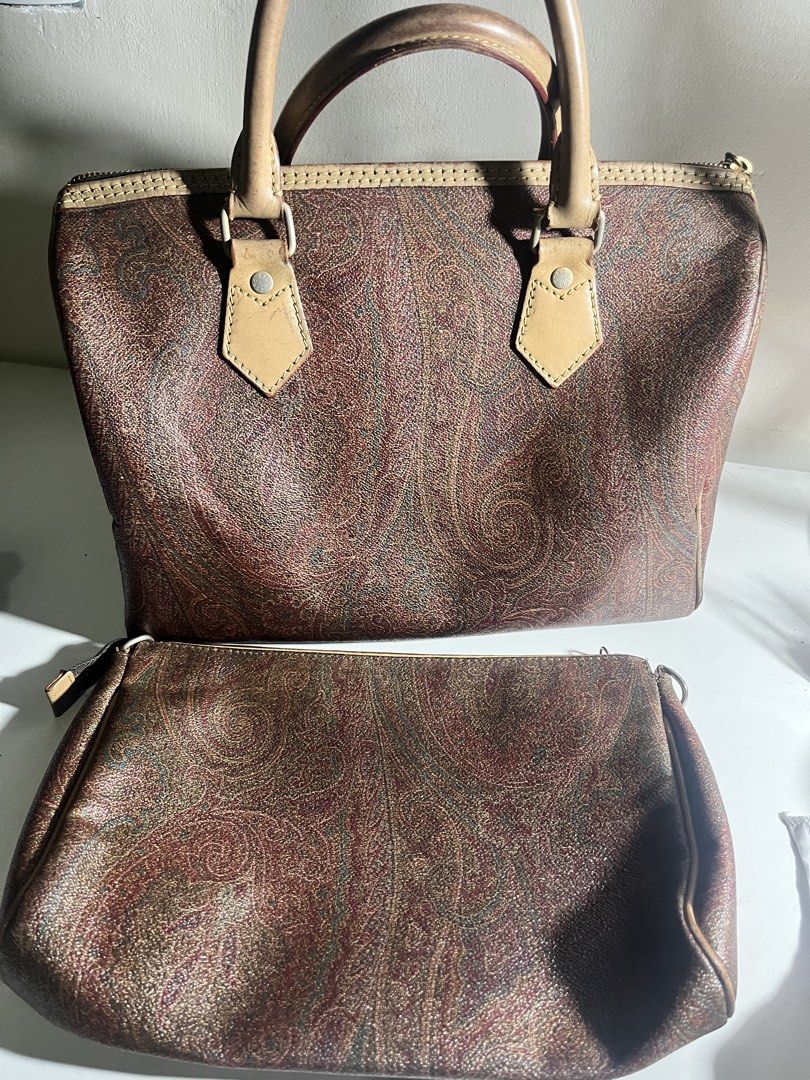 Bundle Etro Paisley Print Boston Bag with Matching Pouch (Category: Luxury Bags & Wallets) located in Manila. Submitted by mjdeclutters.mnl (Listing ID 1451839128, Image 2). Description: - Classic Etro paisley print - Set includes Boston-style bag and matching pouch - Genuine leather trim and handles - Zippers are in excellent working condition - Ideal for travel or everyday use - Iconic and timeless design.