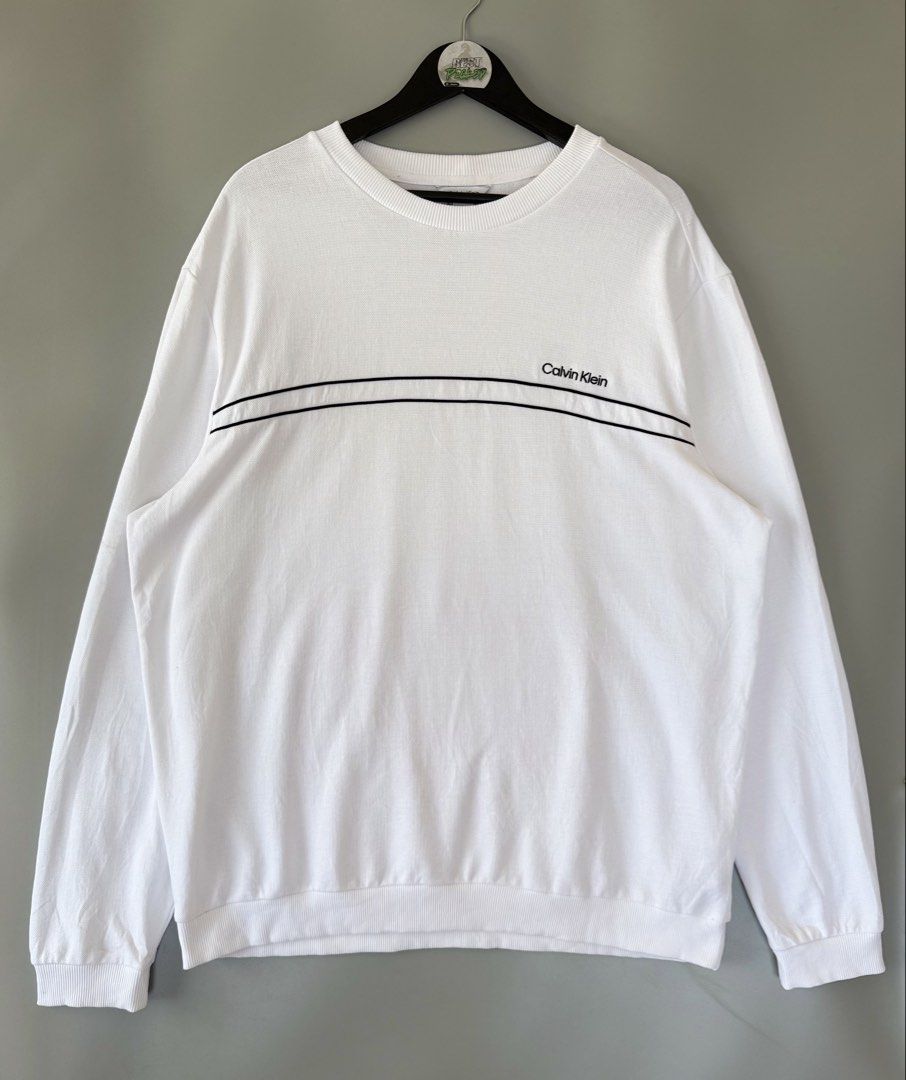 Calvin klein longsleeve sweater (Category: Activewear) located in Cebu City. Submitted by bestpicked (Listing ID 1451739457, Image 1). Description: Authentic Good as new condition Size XL on tag Dimension 26x30 No issue.