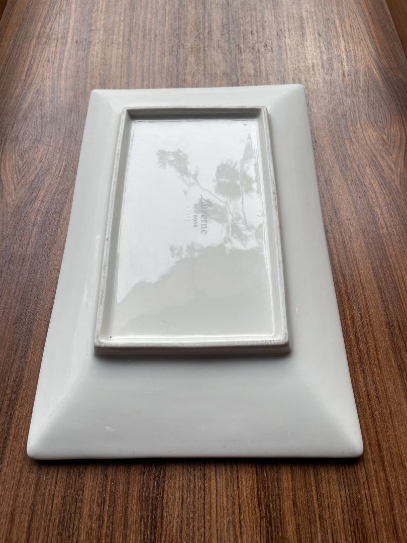 Ceramics Essentials Rectangular Serving Platter White (Category: Dinnerware & Cutlery) located in Singapore. Submitted by goodman1063 (Listing ID 1451793387, Image 2). Description: - White rectangular serving platter - Brand: Ceramica Essentials - Ideal for appetizers, sushi, or small bites - Shows light surface scratches from normal use - Clean and ready for its new home.