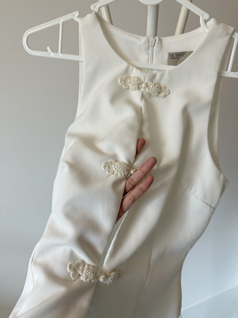 Chinese button knot top (Category: Other Tops) located in Bayan Lepas. Submitted by elynncloset (Listing ID 1451756515, Image 3). Description: Worn once only, small defect as show in the second last button. The buttons are for deco only, not functional Laid flat measurement Chest: 39cm Waist: 34cm Length: 52cm.