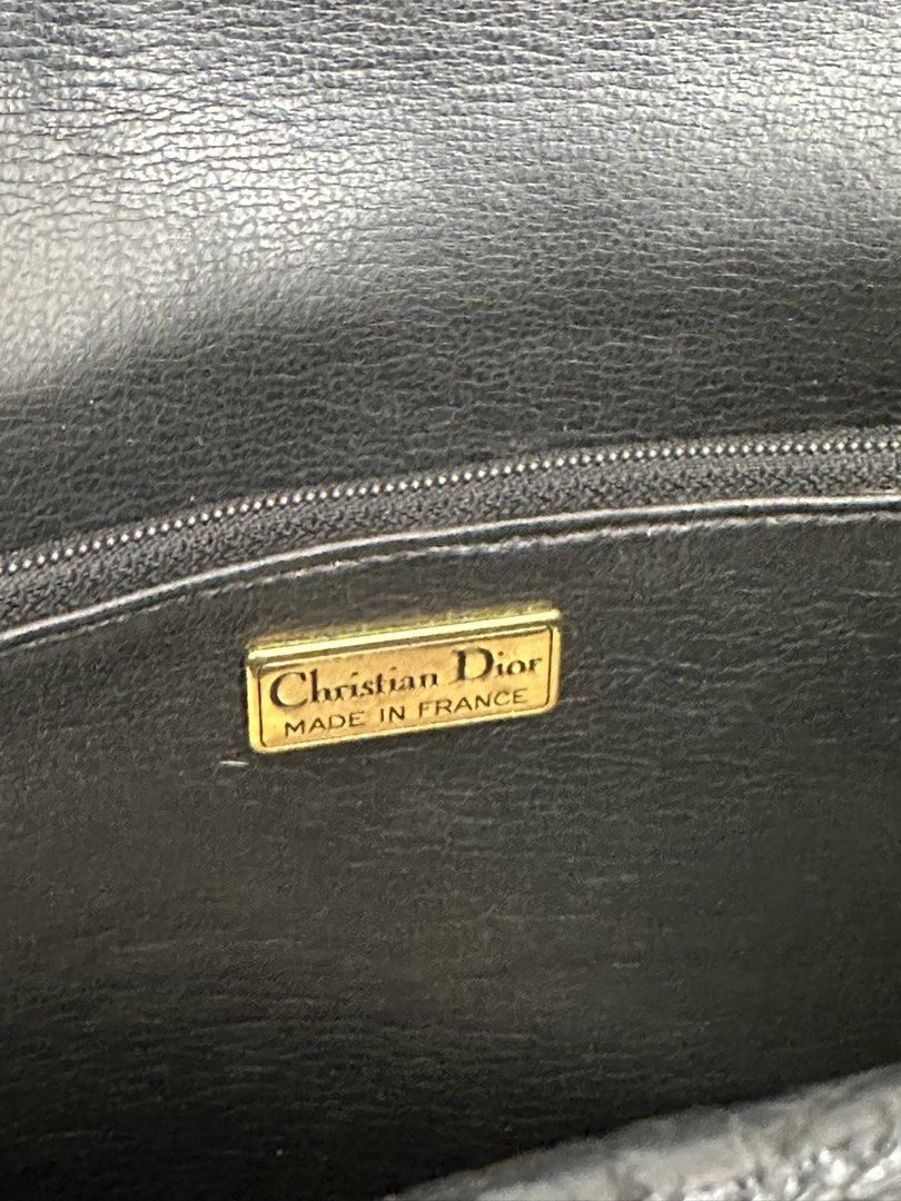 Christian Dior Kelly Handbag (Category: Luxury Bags & Wallets) located in Manila. Submitted by sellerseller19 (Listing ID 1451803628, Image 3). Description: - Classic black leather handbag by Christian Dior - Tan trim detail on the front flap - Gold-tone hardware with iconic CD logo charm - Interior zip pocket for essentials - Authentically Made in France - A timeless addition to any collection.