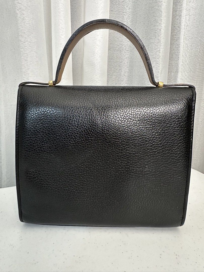 Christian Dior Kelly Handbag (Category: Luxury Bags & Wallets) located in Manila. Submitted by sellerseller19 (Listing ID 1451803628, Image 2). Description: - Classic black leather handbag by Christian Dior - Tan trim detail on the front flap - Gold-tone hardware with iconic CD logo charm - Interior zip pocket for essentials - Authentically Made in France - A timeless addition to any collection.