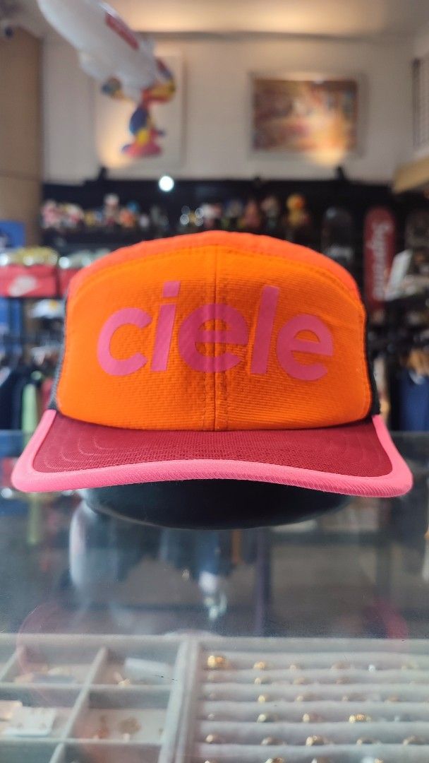 Ciele Orange Trucker Cap Pink Brim Mesh Back (Category: Caps & Hats) located in Baguio. Submitted by andylacanlale (Listing ID 1451722451, Image 1). Description: - Orange Ciele cap - Pink brim and accents - Breathable mesh back - Adjustable strap - Suitable for running or casual wear CIELE ATHLETICS TRK CAP 58CM AUTHENTIC GOOD AS NEW 1,900 + SF.