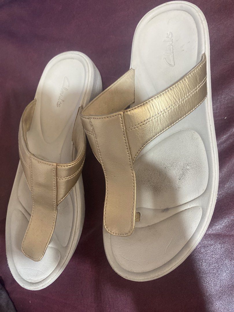 Clarks Gold Thong Sandals (Category: Flats & Sandals) located in Manila. Submitted by narsonlineexpression (Listing ID 1451718540, Image 2). Description: - Brand: Clarks - Style: Gold Thong Sandals - Features: Comfortable footbed, easy slip-on style - Occasion: Great for casual wear - Condition: Minor marks on footbed from storage (please check photos for details).
