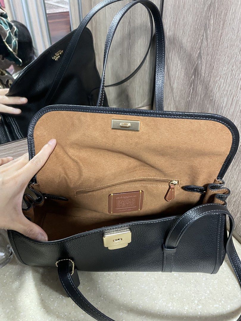 Coach Bridget Flap Shoulder Bag (Category: Bags & Wallets) located in Kuala Lumpur. Submitted by belleohbells (Listing ID 1451783021, Image 3). Description: - Genuine black pebbled leather Coach shoulder bag - Luxurious tan suede-like interior lining - Spacious main compartment - Internal zip pocket for secure storage - Elegant flap closure with a classic turn-lock - Comfortable shoulder straps for easy carrying - Ideal for everyday use and versa