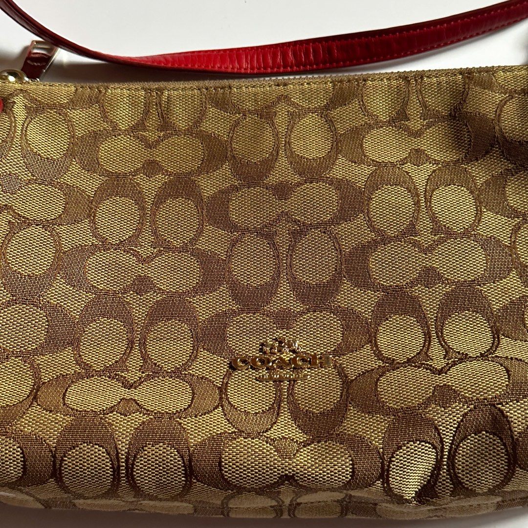 Coach Crossbody Bag with Monogram Logo (Category: Luxury Bags & Wallets) located in Manila. Submitted by lene_ (Listing ID 1451773953, Image 2). Description: •Paint stain underneath • Just needs a light cleaning • Interior condition: 11/10 – looks brand new • No stains or marks inside 📦 Shipping • Delivery fee will be shouldered by the buyer. • Can ship via J&T Express, Lalamove, Grab, or your preferred courier. Feel free to message me if you ha