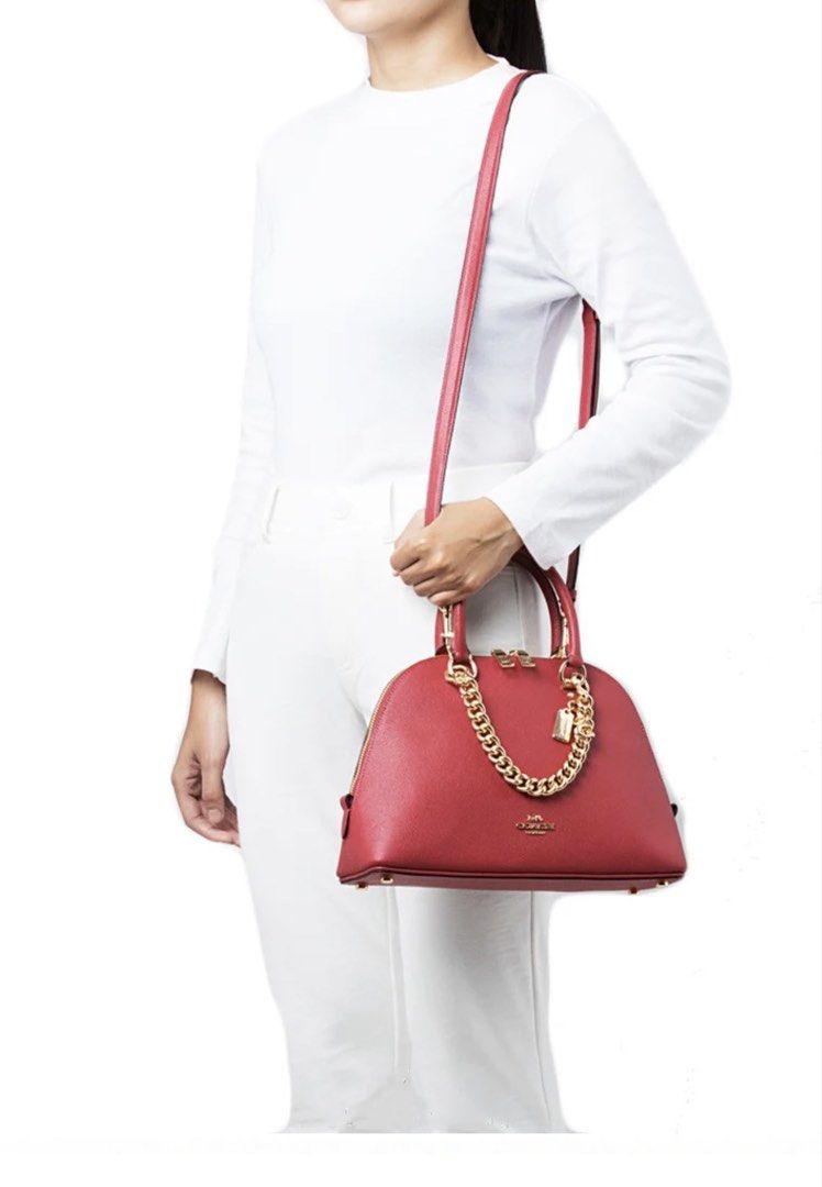 Coach Katy Satchel Original (Category: Luxury Bags & Wallets) located in Muntinlupa City. Submitted by juanastopshop (Listing ID 1451812941, Image 1). Description: COLOR: RED APPLE SIZE: 11 3/4 Inch (L) x 7 3/4 Inch (H) x 4 Inch (W)/ 30cm (L) x 20cm (H) x 10cm (W) PRODUCT DETAILS: - 100% brand new & original from US 🇺🇸 - Crossgrain leather - Inside zip pocket - Zip closure, fabric lining - Handles with 3.75 inches drop - Outside zip pocket - De