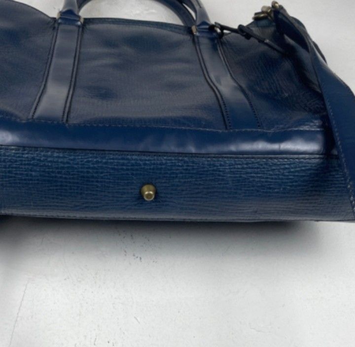 Coach Leather Briefcase Navy Blue (Category: Briefcases) located in Caloocan City. Submitted by noy5o1a (Listing ID 1451843025, Image 2). Description: - Coach navy blue leather briefcase - Textured leather finish for a sophisticated look - Features comfortable top handles - Includes a detachable shoulder strap for versatile carrying options - Comes with original Coach New York hang tag - Ample interior space, ideal for documents, laptop, and esse