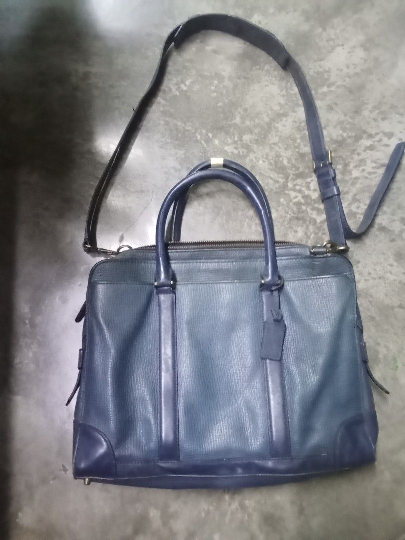Coach Leather Briefcase Navy Blue (Category: Briefcases) located in Caloocan City. Submitted by noy5o1a (Listing ID 1451843025, Image 1). Description: - Coach navy blue leather briefcase - Textured leather finish for a sophisticated look - Features comfortable top handles - Includes a detachable shoulder strap for versatile carrying options - Comes with original Coach New York hang tag - Ample interior space, ideal for documents, laptop, and esse