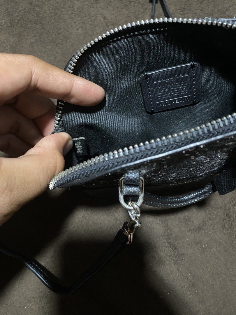 Coach Mini Bag Glitter Star Black (Category: Luxury Bags & Wallets) located in Laguindingan. Submitted by purto_nato42 (Listing ID 1451711234, Image 3). Description: - Adorable mini Coach bag - Black with sparkling glitter stars all over - Features a convenient top handle - Includes a long strap for versatile wear - Secure zipper closure.