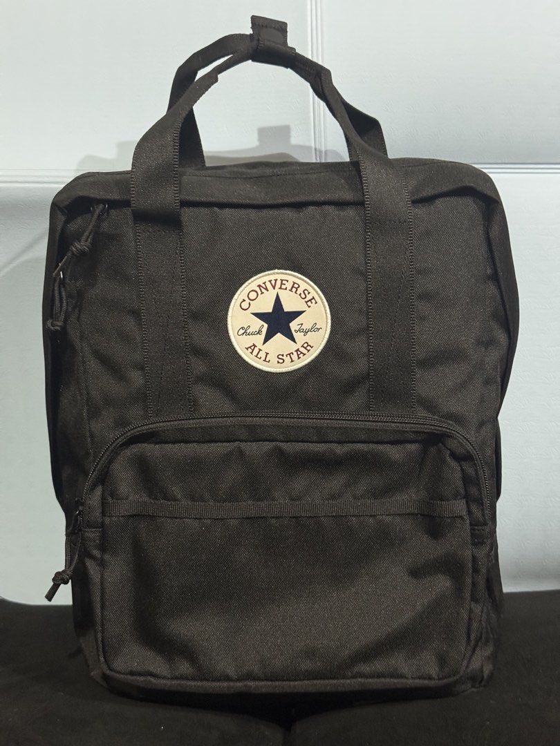 Converse All Star Black Backpack (Category: Backpacks) located in Rodriguez. Submitted by leo_mjjmpj (Listing ID 1442437187, Image 2). Description: - Classic black Converse backpack - Features iconic Chuck Taylor All Star logo - Main compartment for storage - Additional front pocket with zipper - Includes top handle for carrying - Adjustable shoulder straps for comfort - Ideal for everyday use.