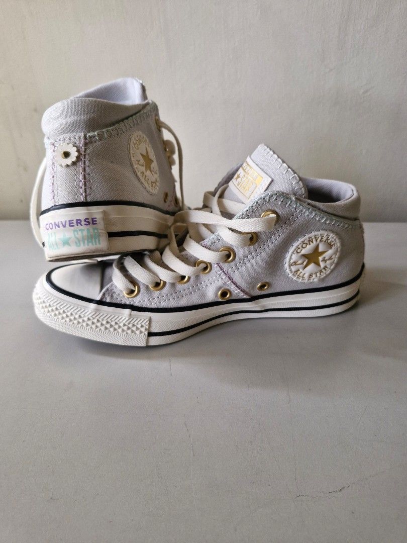 Converse All Star Chuck Taylor Mid Top Sneakers (Category: Sneakers) located in Quezon City. Submitted by jcycle02 (Listing ID 1451765620, Image 1). Description: - Grey Converse Chuck Taylor All Star mid-top sneakers - Lace-up style with gold eyelets - Classic Chuck Taylor logo patch on the side - Durable rubber sole - Made in Indonesia - Size: US 6 (UK 3.5, EUR 23) .