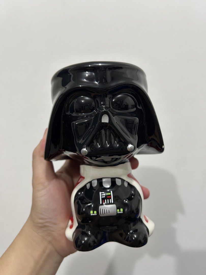 Darth Vader Ceramic Mug (Category: Coffee & Tea Tableware) located in Makati City. Submitted by michellecollado07 (Listing ID 1451892310, Image 1). Description: - Cool Darth Vader mug - Black ceramic with red cape detail - Ideal for any Star Wars fan - Perfect for coffee or tea - Unique collectible item.