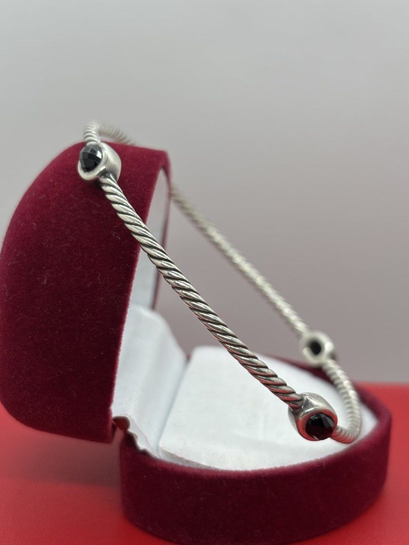 David Yurman 925 Sterling Silver Hematite Station Bangle (Category: Bracelets) located in Bacoor. Submitted by cryptl (Listing ID 1451713465, Image 2). Description: - Authentic David Yurman Bangle - Sterling Silver with iconic twisted cable design - Features four genuine Hematite stations - Size: 8 inches - Versatile: Perfect for stacking or wearing solo - Classic, timeless piece.