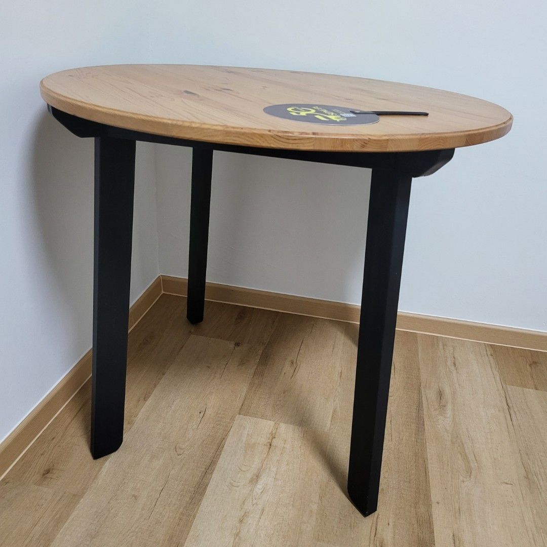 Dining table (Category: Tables & Sets) located in Singapore. Submitted by basedinbkk (Listing ID 1446432250, Image 3). Description: - Round dining table with a natural wood grain finish - Sturdy black metal legs for a modern look - Wood tabletop material - Suitable for spaces up to 1.2m - Meetup in Punggol.
