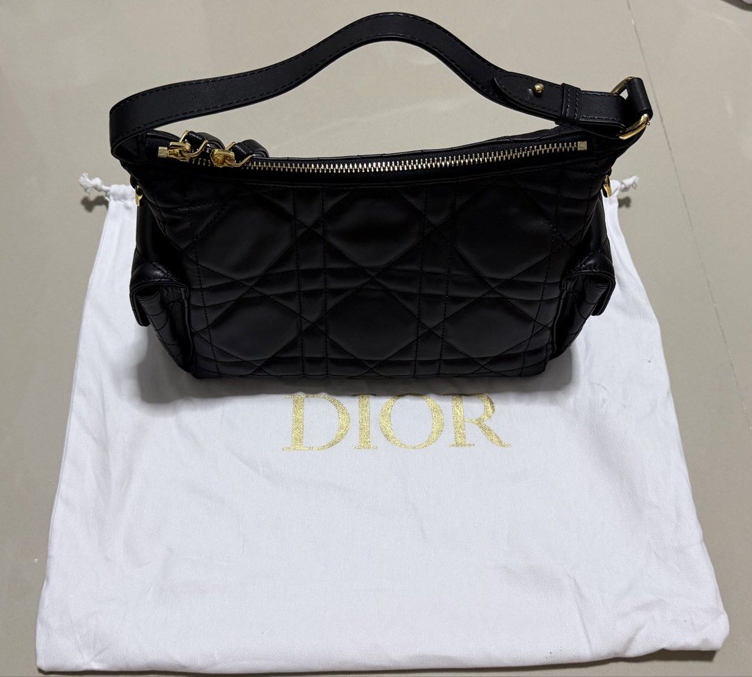 Dior D-Dream bag medium macrocannage (Category: Luxury Bags & Wallets) located in Pasig City. Submitted by dancieaa03 (Listing ID 1451875743, Image 3). Description: - Dior Hobo Bag - Color: Black - Material: Quilted Leather - Hardware: Gold - Condition: like new, clean interior - Includes: Dior dust bag - Features: Spacious, stylish This bag is NGA.