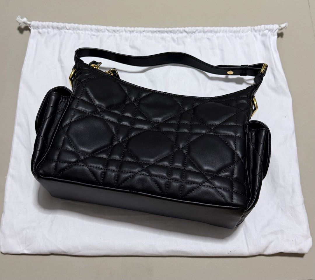 Dior D-Dream bag medium macrocannage (Category: Luxury Bags & Wallets) located in Pasig City. Submitted by dancieaa03 (Listing ID 1451875743, Image 1). Description: - Dior Hobo Bag - Color: Black - Material: Quilted Leather - Hardware: Gold - Condition: like new, clean interior - Includes: Dior dust bag - Features: Spacious, stylish This bag is NGA.