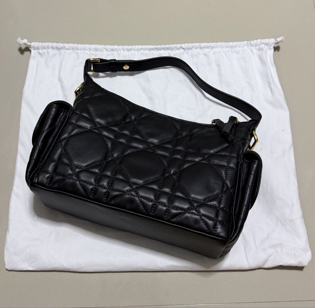 Dior D-Dream bag medium macrocannage (Category: Luxury Bags & Wallets) located in Pasig City. Submitted by dancieaa03 (Listing ID 1451875743, Image 2). Description: - Dior Hobo Bag - Color: Black - Material: Quilted Leather - Hardware: Gold - Condition: like new, clean interior - Includes: Dior dust bag - Features: Spacious, stylish This bag is NGA.