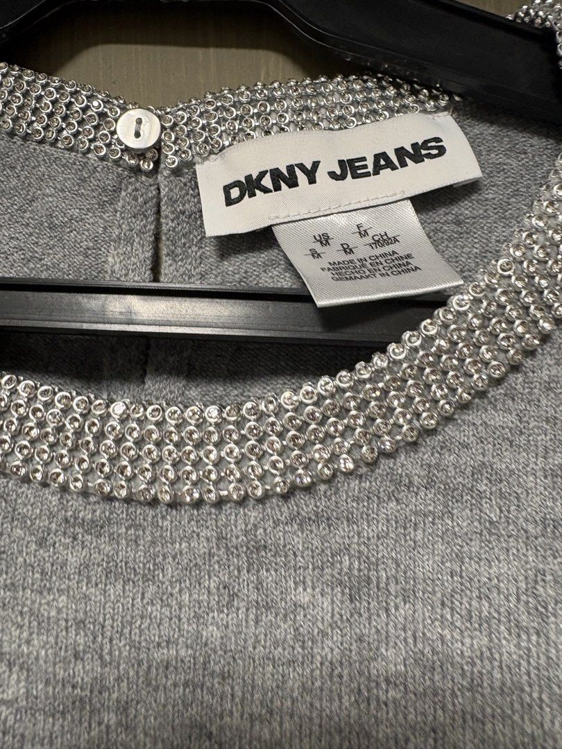 DKNY Jeans Grey Embellished Neck Sweater (Category: Coats, Jackets and Outerwear) located in Quezon City. Submitted by ejay75 (Listing ID 1451768476, Image 2). Description: - DKNY Jeans grey long-sleeved sweater - Features a sparkly embellished neckline - Classic and simple design - Ideal for layering or wearing solo - Comfortable and stylish US MEDIUM SIZE. RUNS BIG TAG INTACT BRANDNEW.
