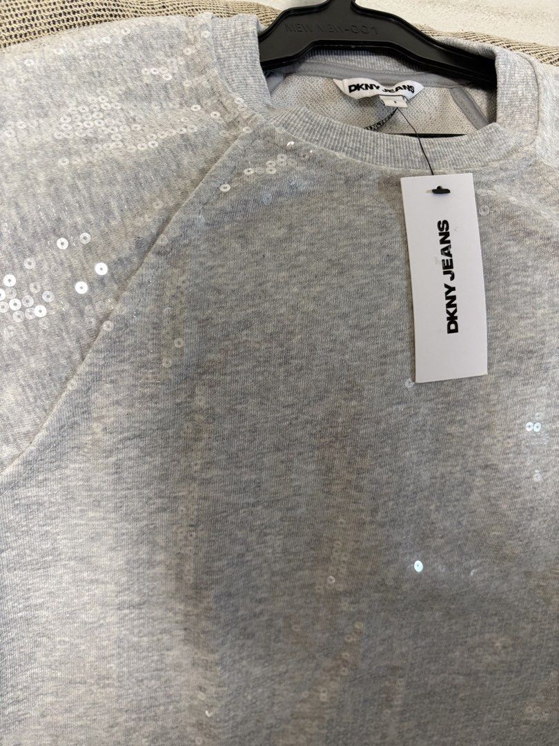 DKNY Jeans Grey Sequin Sweatshirt (Category: Longsleeves) located in Quezon City. Submitted by ejay75 (Listing ID 1451767449, Image 2). Description: - Grey DKNY Jeans sweatshirt - All-over sequin embellishments - Short sleeves with a slight puff detail - Perfect for dressing up casual outfits - Brand new with original tags attached US Small size. Tag intact, oversized.