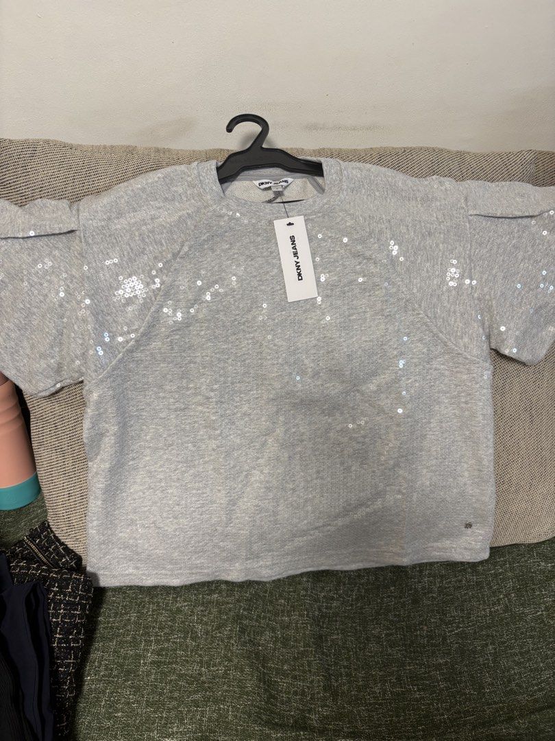 DKNY Jeans Grey Sequin Sweatshirt (Category: Longsleeves) located in Quezon City. Submitted by ejay75 (Listing ID 1451767449, Image 1). Description: - Grey DKNY Jeans sweatshirt - All-over sequin embellishments - Short sleeves with a slight puff detail - Perfect for dressing up casual outfits - Brand new with original tags attached US Small size. Tag intact, oversized.