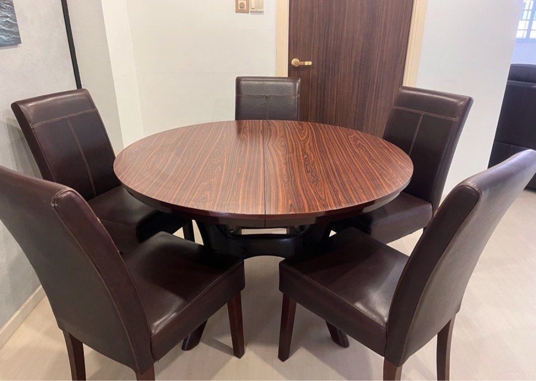 Extendable Round Dining Table (Table Only) (Category: Tables & Sets) located in Singapore. Submitted by runding (Listing ID 1451731979, Image 3). Description: - Extendable round dining table, before extension is 1.2m diameter - No Chair - Dark wood base.