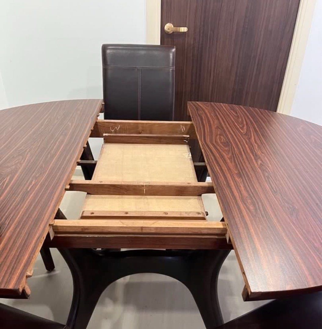 Extendable Round Dining Table (Table Only) (Category: Tables & Sets) located in Singapore. Submitted by runding (Listing ID 1451731979, Image 2). Description: - Extendable round dining table, before extension is 1.2m diameter - No Chair - Dark wood base.