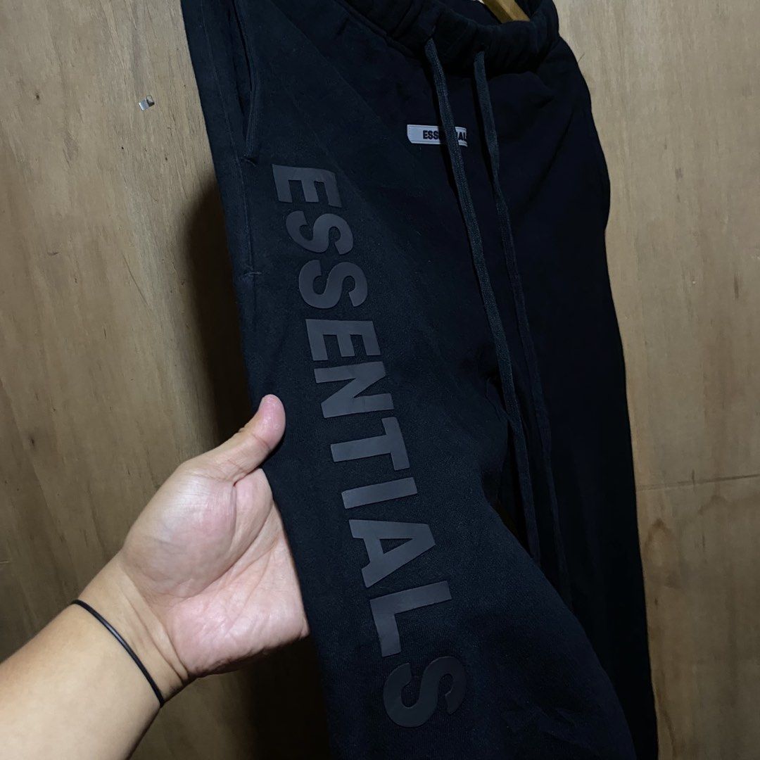 Fear of God Essentials Black Sweatpants (Category: Joggers) located in Manila. Submitted by drp4drp (Listing ID 1451845873, Image 2). Description: Dimes: Waist 28-33 x Length 38 No issues 10/10 Color rate - Brand: Fear of God Essentials - Color: Black - Features: Essentials logo printed on the side - Waist: Elastic waistband with drawstring - Cuffs: Ribbed cuffs - Style: Comfortable and stylish for everyday wear.