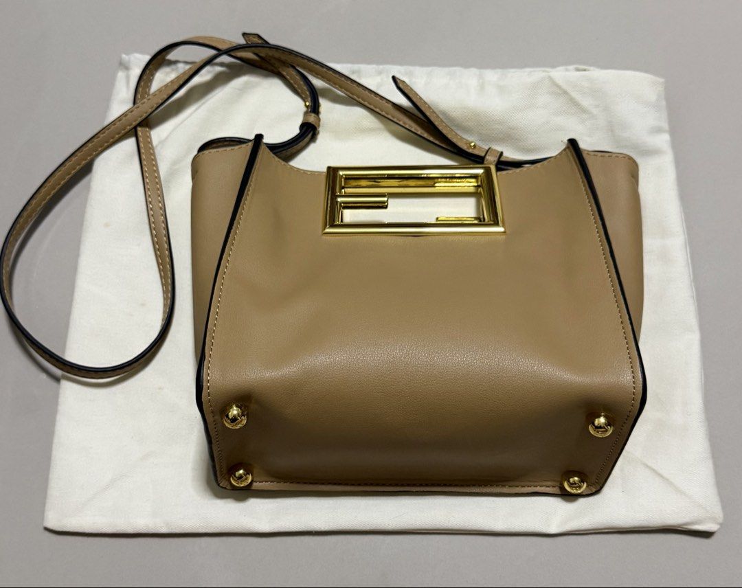 Fendi Way Small Tote (Category: Luxury Bags & Wallets) located in Pasig City. Submitted by dancieaa03 (Listing ID 1451872875, Image 2). Description: - Fendi Way - Color: Tan Leather - Iconic Gold FF Logo Hardware - Detachable Shoulder Strap - Protective Metal Feet on Bottom - Condition: Great - Includes Dust Bag.