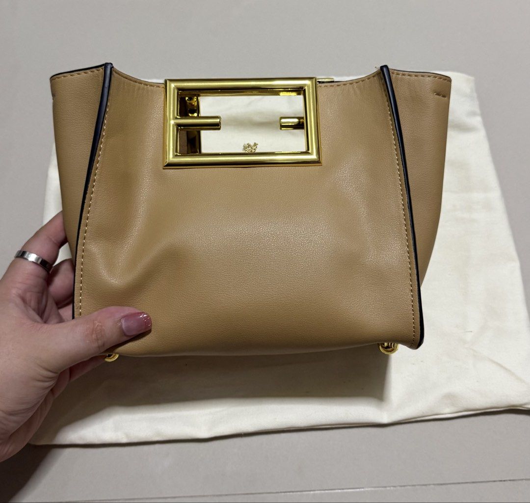 Fendi Way Small Tote (Category: Luxury Bags & Wallets) located in Pasig City. Submitted by dancieaa03 (Listing ID 1451872875, Image 1). Description: - Fendi Way - Color: Tan Leather - Iconic Gold FF Logo Hardware - Detachable Shoulder Strap - Protective Metal Feet on Bottom - Condition: Great - Includes Dust Bag.