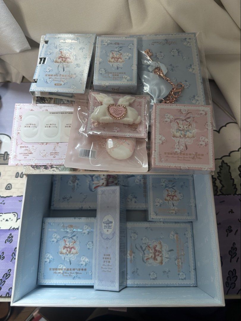 Flower Knows Bunny Garden 13 items makeup Set (Category: Makeup) located in Manila. Submitted by honeyglow (Listing ID 1429074397, Image 1). Description: 1 mirror blue 1 eyeshadow palette 01 white bunny 1 hand cream snowy gardenia 1 blush 02 bunny lullaby 1 cushion case shell blue 1 cream foundation W03 cream beige 1 lip balm creamy blue 1 keychain 1 hairclip 1 sample perfume 1 foundation sample card 1 face puff 1 Fk box.