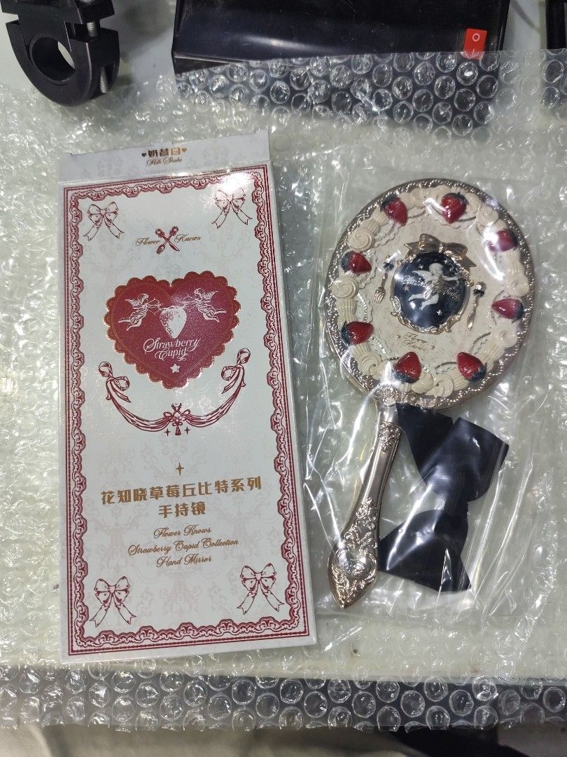Flower Knows Strawberry Cupid Collection Hand Mirror (Category: Mirrors) located in Tacloban City. Submitted by choutsuri (Listing ID 1451721150, Image 3). Description: Authentic Flower Knows Strawberry Cupid Hand Mirror 650 php each. Available: Black version 🖤 Red version ❤️ -Brand new -With box -Intact mirror seal -Super pretty!! Check my listing for more photos! 🩷.