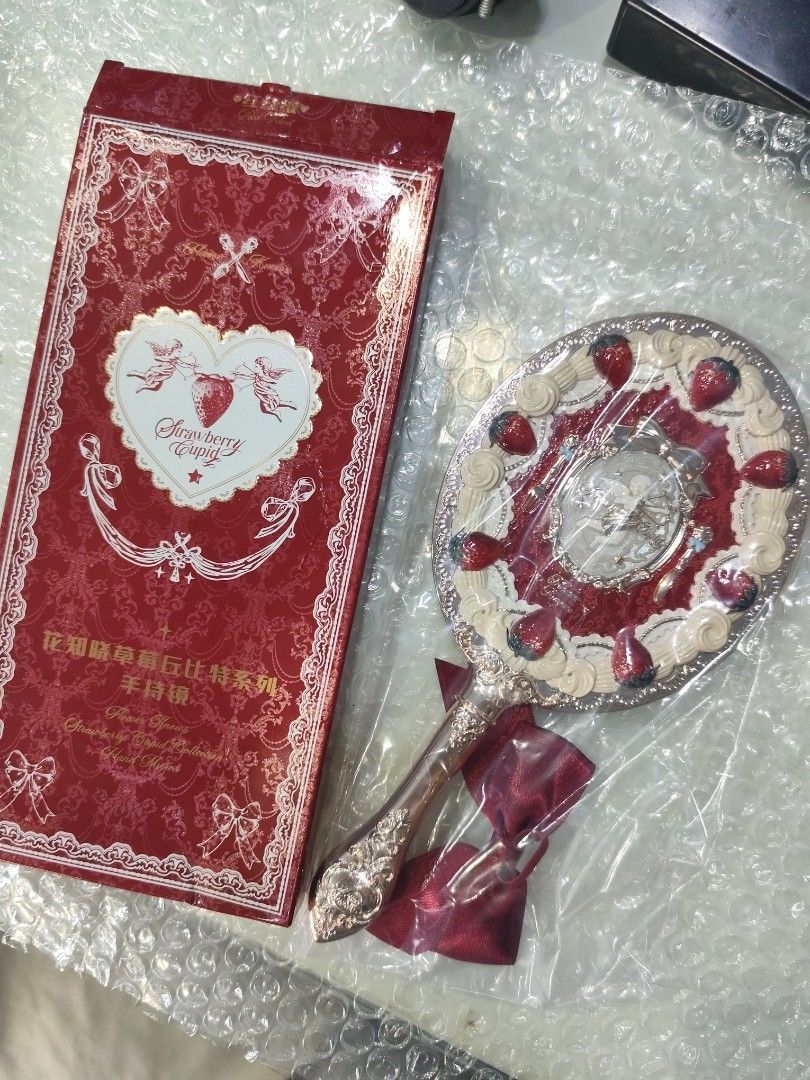 Flower Knows Strawberry Cupid Collection Hand Mirror (Category: Mirrors) located in Tacloban City. Submitted by choutsuri (Listing ID 1451721150, Image 2). Description: Authentic Flower Knows Strawberry Cupid Hand Mirror 650 php each. Available: Black version 🖤 Red version ❤️ -Brand new -With box -Intact mirror seal -Super pretty!! Check my listing for more photos! 🩷.