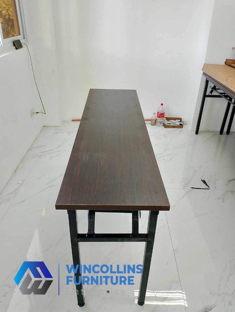 Foldable Training Table / Staff Table / Study Desk (Category: Tables & Sets) located in Caloocan City. Submitted by mayanncamu.furniture (Listing ID 1451714874, Image 3). Description: Foldable Training Table / Study Desk / Office Table Melamine scratch proof table top and modesty With 2nd layer shelf Tubular legs Color: Wenge.