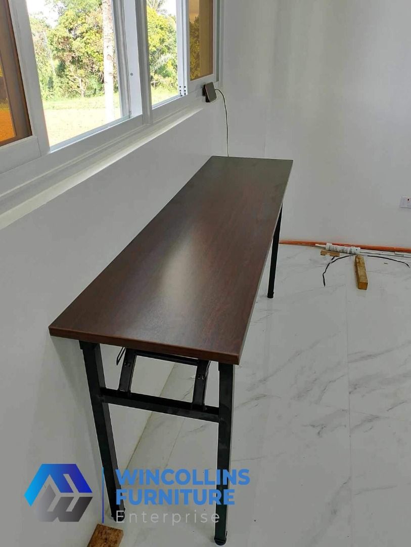 Foldable Training Table / Staff Table / Study Desk (Category: Tables & Sets) located in Caloocan City. Submitted by mayanncamu.furniture (Listing ID 1451714874, Image 2). Description: Foldable Training Table / Study Desk / Office Table Melamine scratch proof table top and modesty With 2nd layer shelf Tubular legs Color: Wenge.