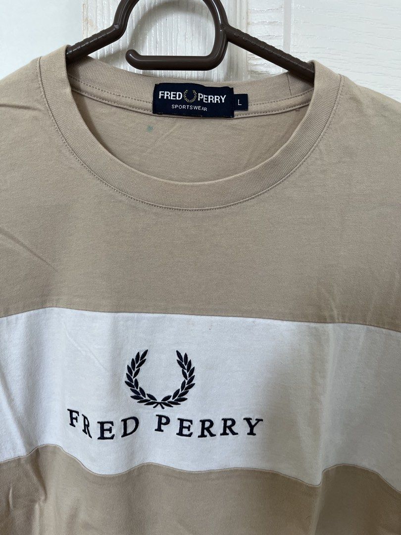 Fred Perry T- Shirt (Category: Tshirts & Polo Shirts ) located in Manila. Submitted by vjr21 (Listing ID 1451809472, Image 2). Description: Fred Perry T-Shirt Color: Brown Size: Medium Condition: Well Used Dimensions: 21.5 x 27.