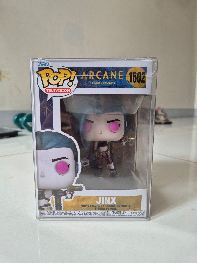Funko Pop Arcance Jinx (Category: Designer & Blind Box Toys) located in Manila. Submitted by sey_rahh (Listing ID 1451738826, Image 1). Description: Selling authentic Funko Pop! Jinx #1602 from the hit Netflix series Arcane / League of Legends. ​Item Details: ​Character: Jinx (#1602) ​Series: Pop! Television / Arcane: League of Legends ​Condition: Excellent box condition (Never removed from box) Includes: Comes enclosed in a clear acrylic / hard 