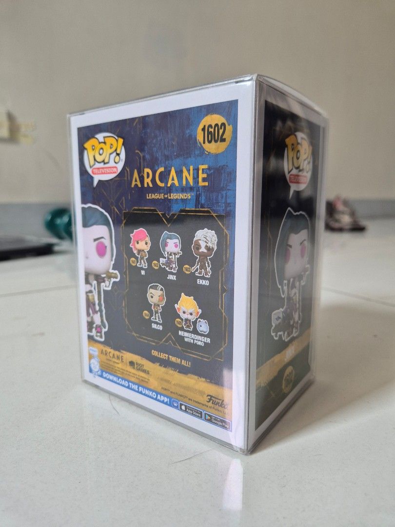 Funko Pop Arcance Jinx (Category: Designer & Blind Box Toys) located in Manila. Submitted by sey_rahh (Listing ID 1451738826, Image 3). Description: Selling authentic Funko Pop! Jinx #1602 from the hit Netflix series Arcane / League of Legends. ​Item Details: ​Character: Jinx (#1602) ​Series: Pop! Television / Arcane: League of Legends ​Condition: Excellent box condition (Never removed from box) Includes: Comes enclosed in a clear acrylic / hard 