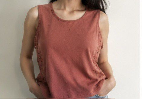 Gilded Intent Brown Studded Tank Top Size S (Category: Sleeveless) located in Las Pinas. Submitted by katb86 (Listing ID 1451780802, Image 1). Description: - Brand: Gilded Intent - Color: Brown - Style: Tank top, sleeveless - Features: Unique stud details on the sides - Occasion: Casual wear, layering -model is wearing a different top but similar style .