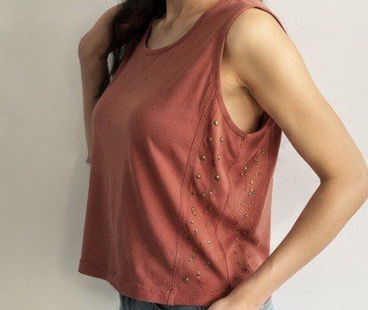 Gilded Intent Brown Studded Tank Top Size S (Category: Sleeveless) located in Las Pinas. Submitted by katb86 (Listing ID 1451780802, Image 3). Description: - Brand: Gilded Intent - Color: Brown - Style: Tank top, sleeveless - Features: Unique stud details on the sides - Occasion: Casual wear, layering -model is wearing a different top but similar style .